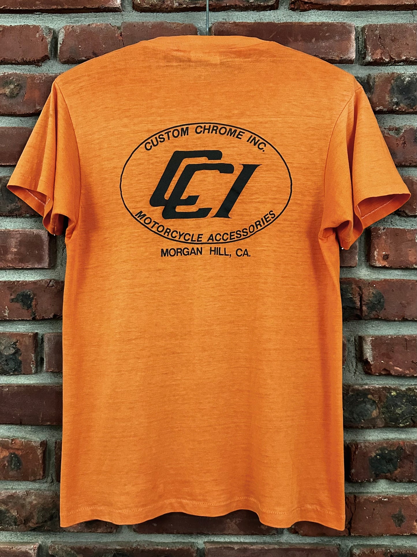 Vintage 80s 1980s CUSTOM CHROME INC Motorcycle Dealer T-Shirt Speed Shop Accessories Orange Hanes Mens Small S