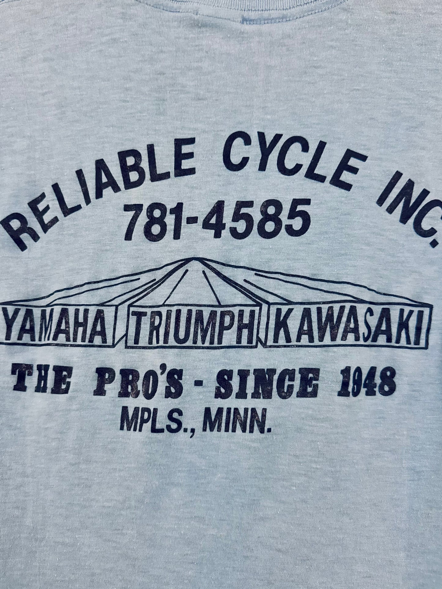 Vintage 80s 1980s YAMAHA TRIUMPH KAWASAKI Reliable Cycle Inc Minneapolis Dealer T SHIRT Put Something Exciting Between Your Legs Devknit Mens Small S 17.25x26.25